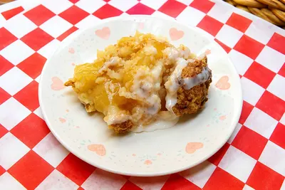 A serving of Surry County sonker topped with sweet milk dip